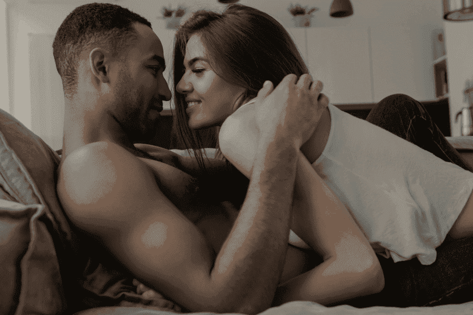 Couple building tension with foreplay