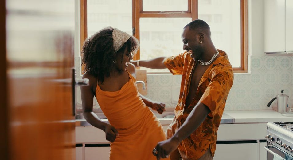 couple dancing in their kitchen at home