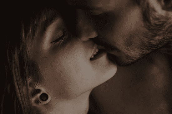 Couple kissing with a close up of their faces