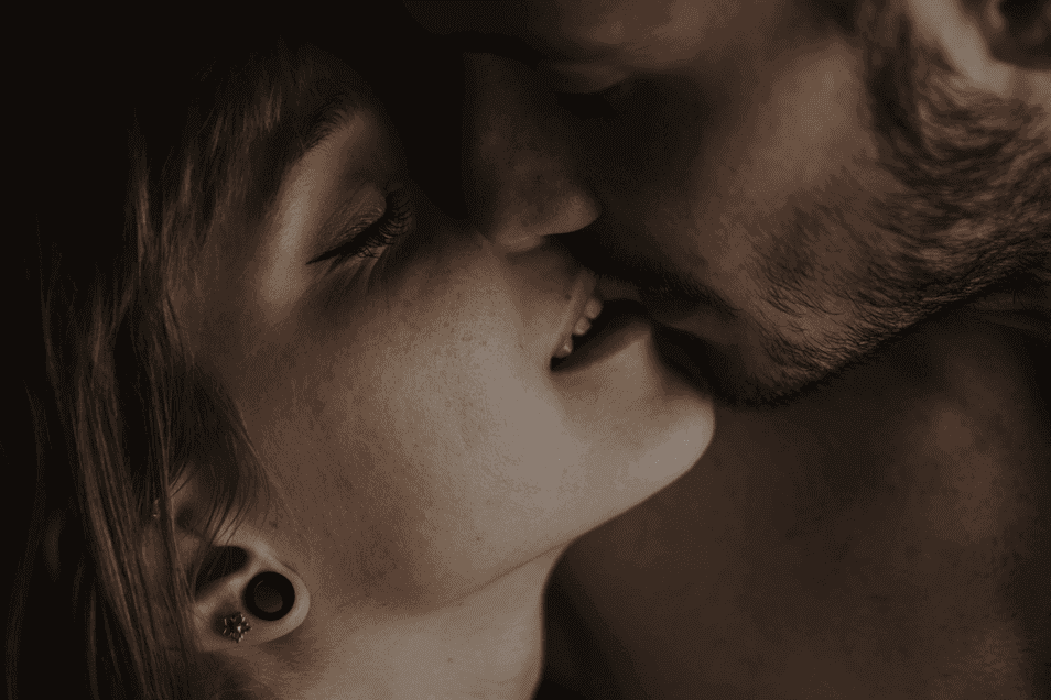 Couple kissing with a close up of their faces