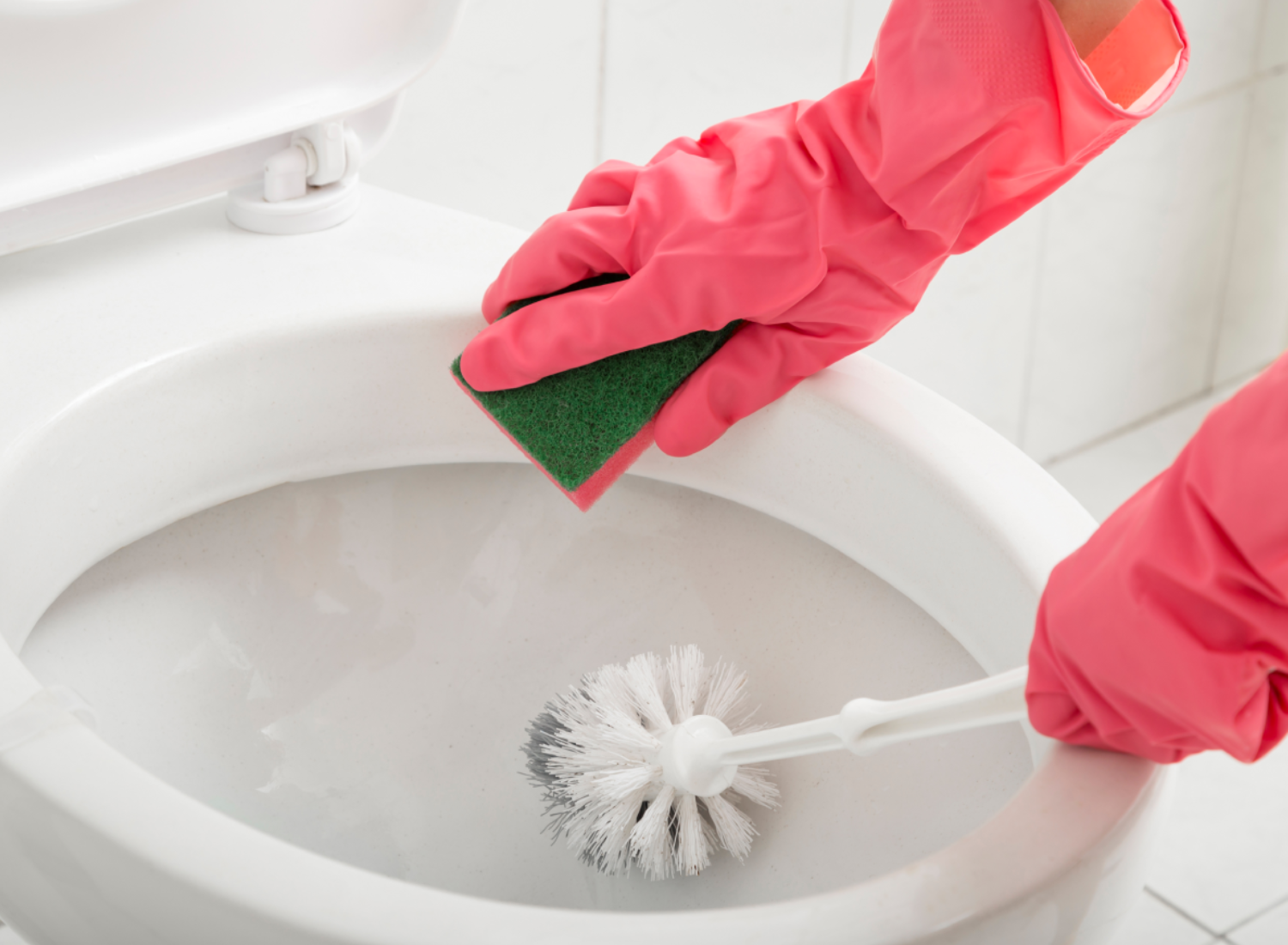 a person cleaning toilet