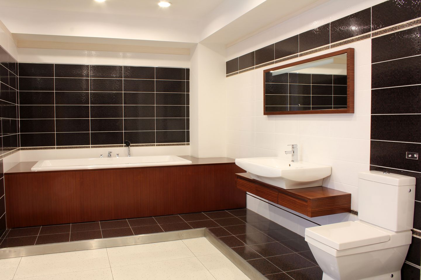 bathroom interior showing toilet, sink, and bathtub