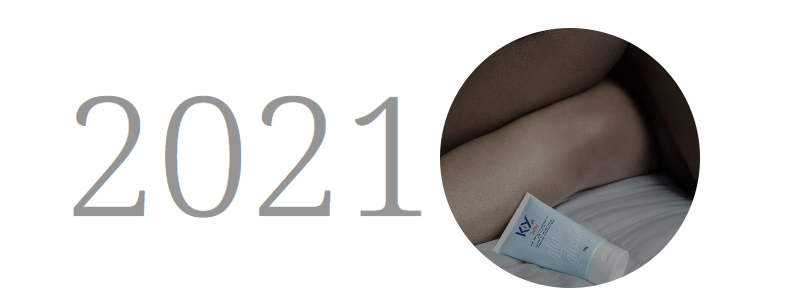 K-Y lube bottle next to a pair of legs on a bed