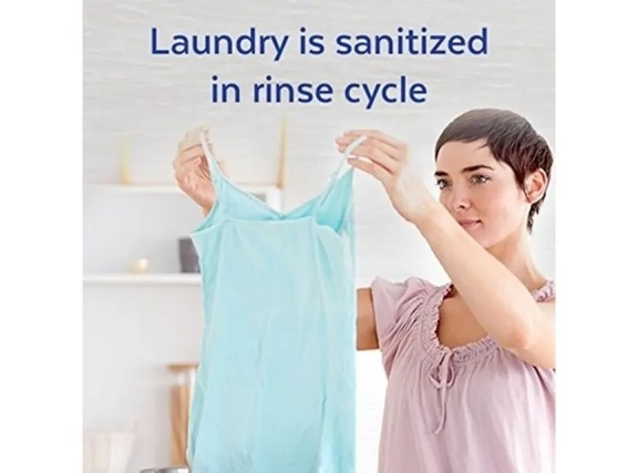 Clean athletic wear being held up in front of an adult. Text says "Laundry is sanitized in rinse cycle"