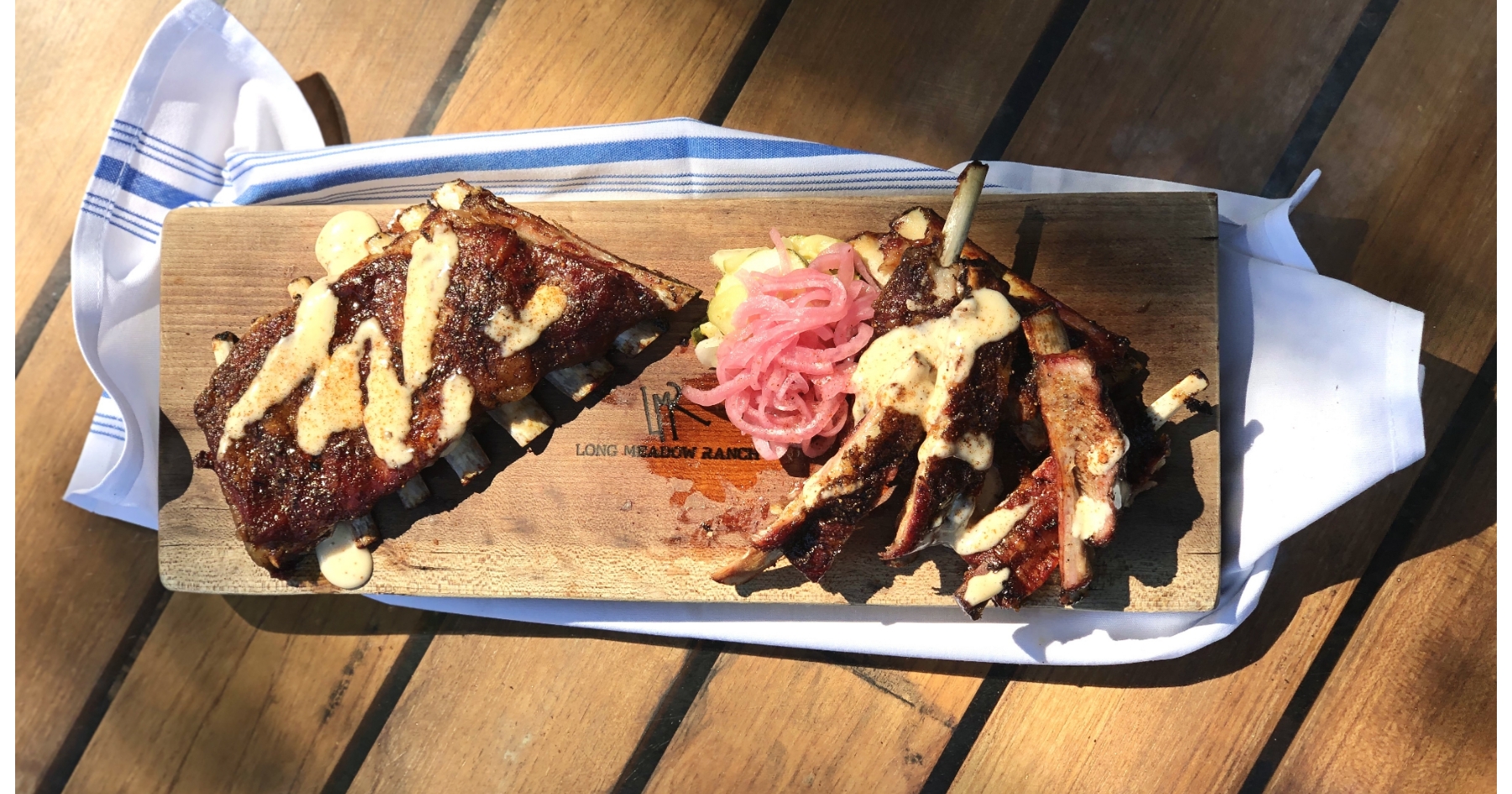 BBQ Denver Lamb Ribs with Alabama White Sauce and Pickled Red Onions