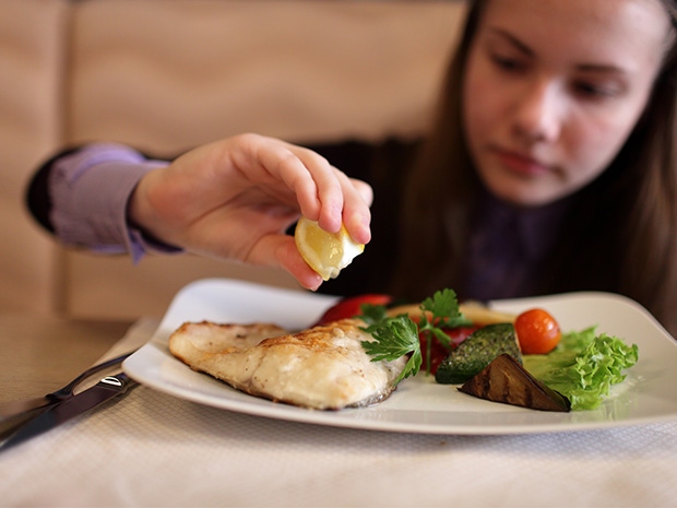 kid eating seafood kid eating seafood