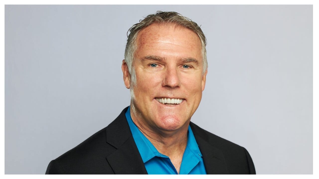 smiling man with short hair