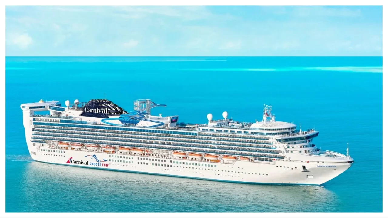 large white cruise ship in flat aqua seas