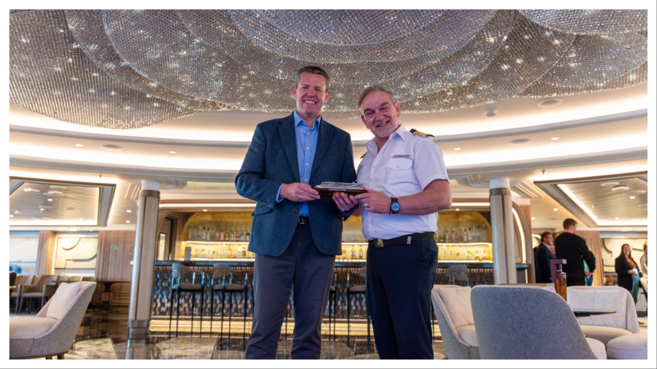 Welsh first Minister and master of Regent Seven Seas' Gradeur inside the cruise ship lounge