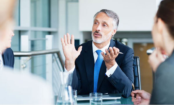 Businessman having a discussion with people