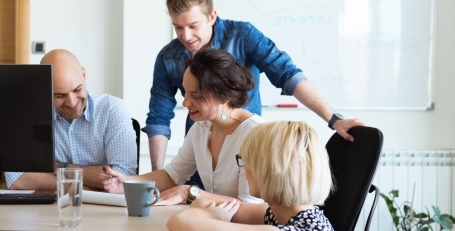 four colleagues working together