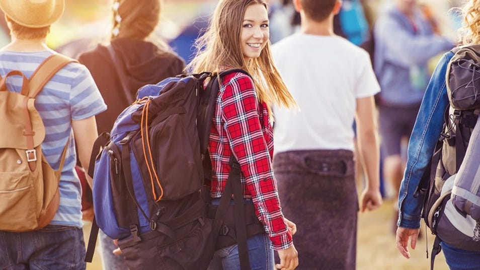 a girl wearing a bad looks back