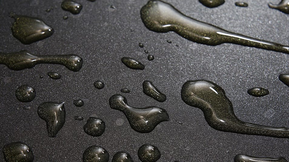 Water droplets on a dark surface