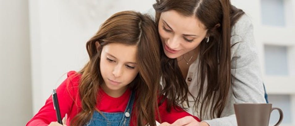 a child and her mother writing or coloring or drawing