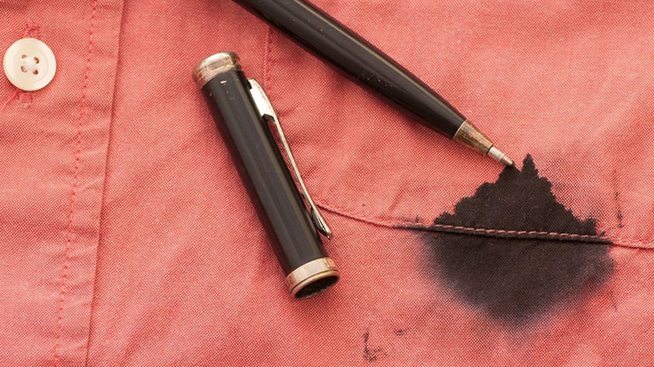 A red shirt with a black ink stain