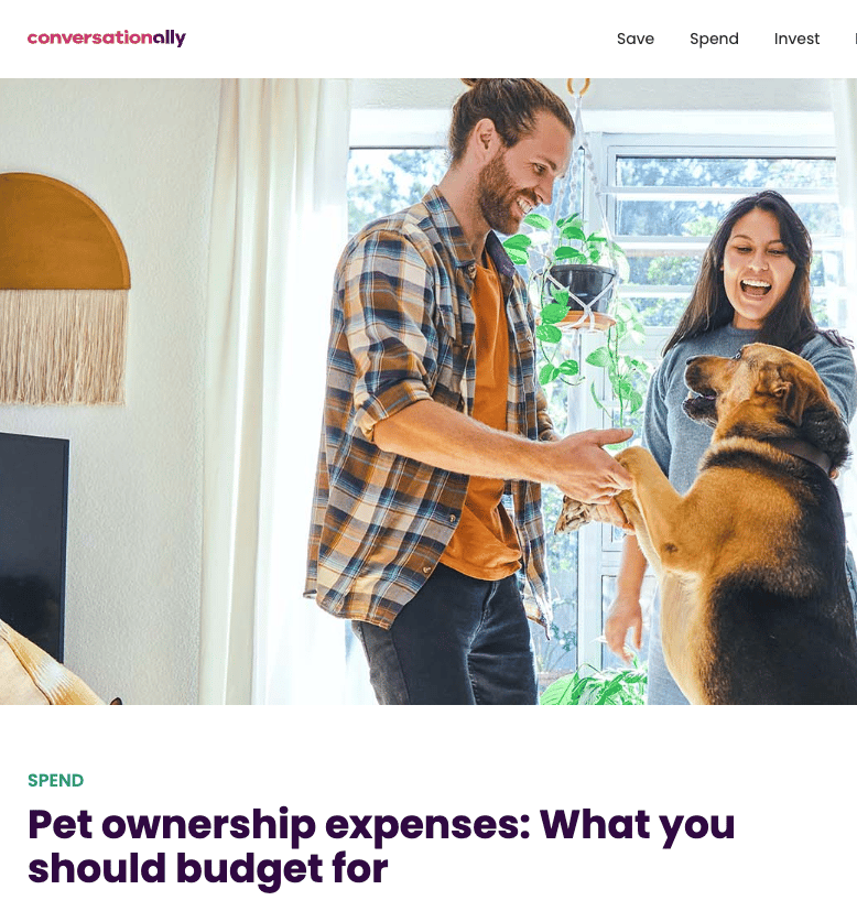 An image of a man and woman happily playing with a black-and-brown dog standing on his hind legs in their home accompanies an article about budgeting for pet ownership expenses. An image of a man and woman happily playing with a black-and-brown dog standing on his hind legs in their home accompanies an article about budgeting for pet ownership expenses.