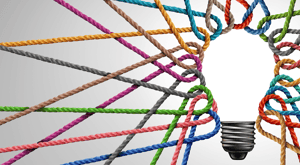 A lightbulb surrounded by multicolored ropes to represent the concept of responsible marketing. A lightbulb surrounded by multicolored ropes to represent the concept of responsible marketing.