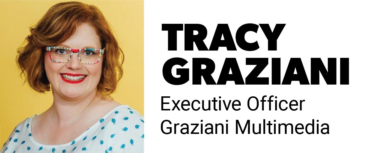 Portrait of Tracy Graziani, Executive Officer at Graziani Multimedia, smiling in front of a yellow background.
