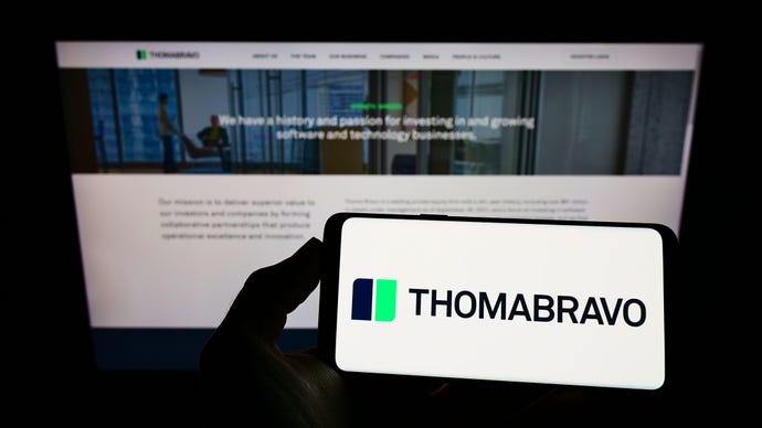 Image of Thoma Bravo private equity investor site on mobile phone and laptop screen