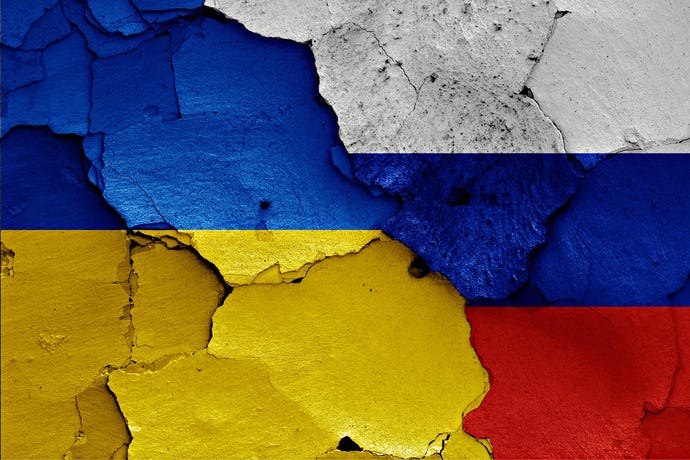 Flags of Ukraine and Russia, tattered