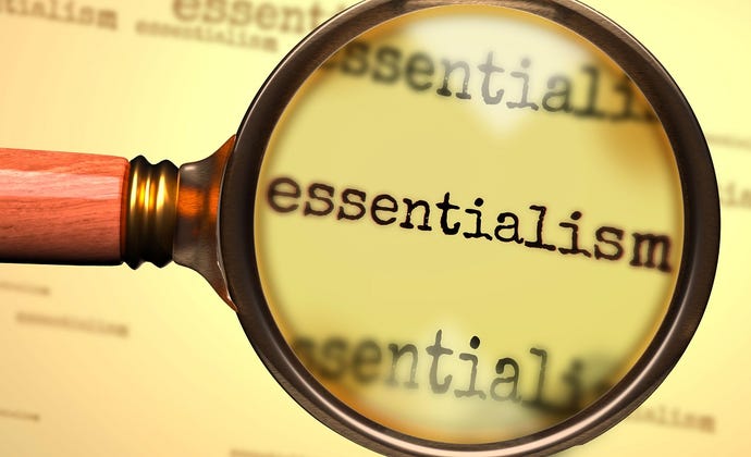 Magnifying glass over the word "essentialism"
