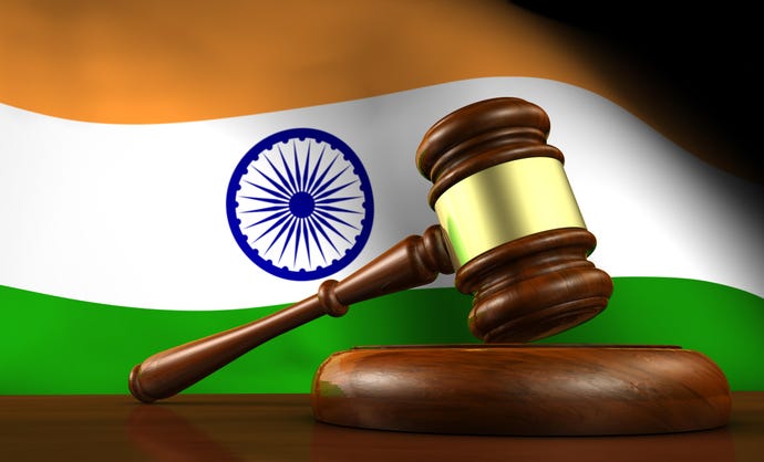 A gavel in front of the Indian flag