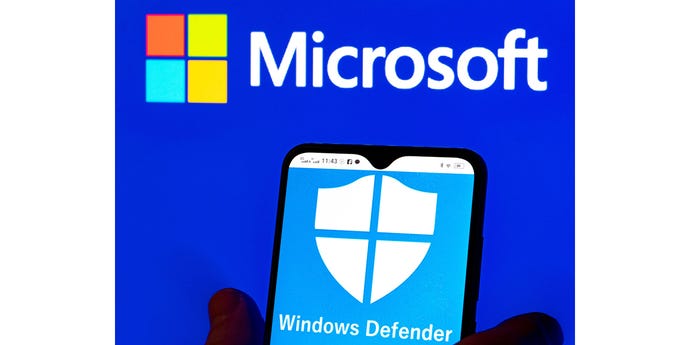 photo illustration of Microsoft Windows Defender logo displayed on a smartphone and Microsoft logo in the background