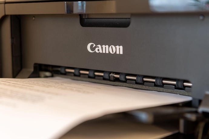 Canon printer printing something out.