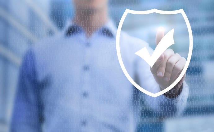 Man in background touching an image of a security shield with a checkmark on it