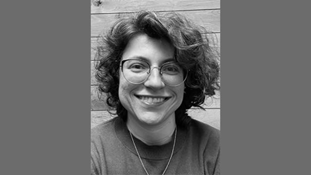 Angela Marafino, product manager for Microsoft, has curly hair and glasses