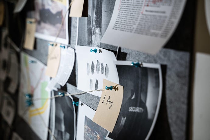 Police Investigation Board And Crime Victim Information, with yarn tracing connections between evidence