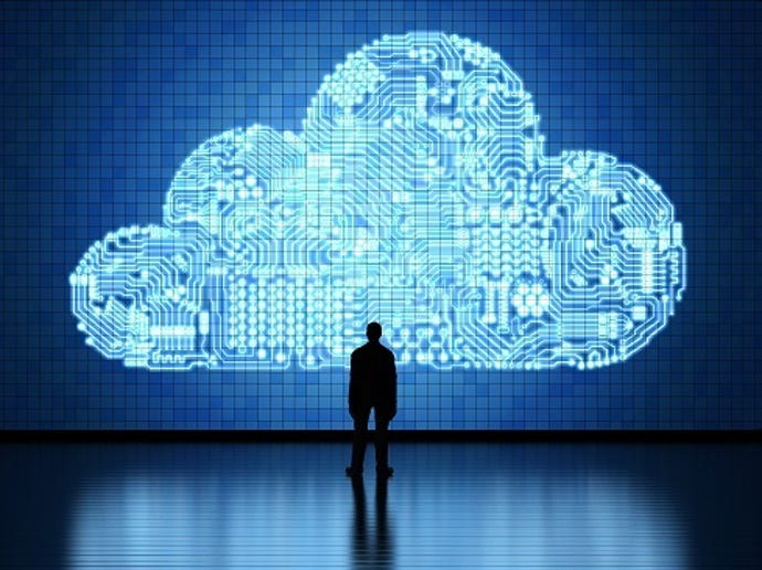 business person standing in front of a digital cloud looking involved
