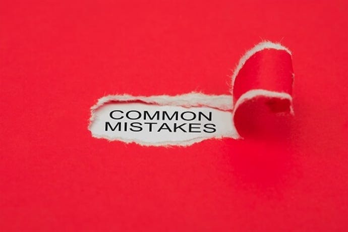 Red paper with a torn out hole and the words common mistakes against a white background is visible.