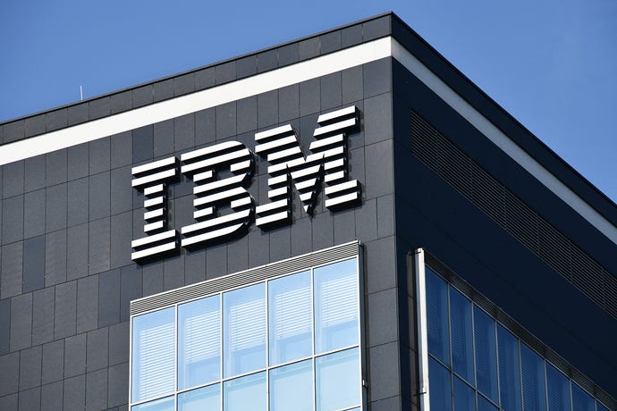 IBM logo on the side of the company's office building in Dusseldorf, Germany, under a bright blue sky