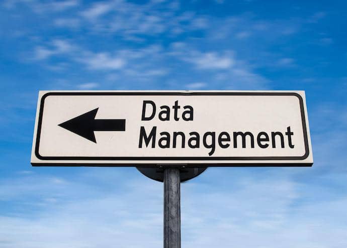 Data Management road sign, arrow on blue sky background.