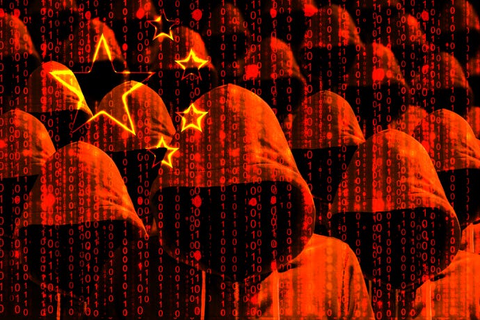 Group of hooded hackers shining through a digital chinese flag cybersecurity concept