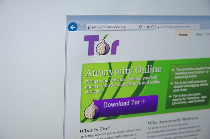 A computer screen shows details of Tor main page on its web site. Selective focus.
