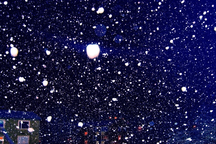 photo of snow blizzard and lights at night outside in Stockholm, Sweden