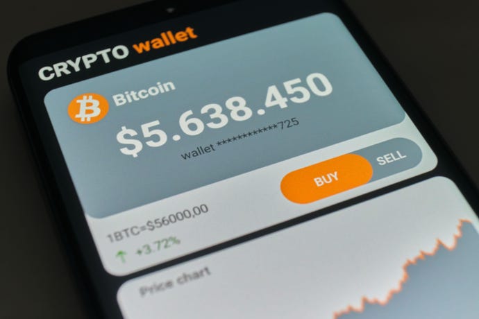 Mobile phone displaying cryptocurrency wallet with Bitcoin balance