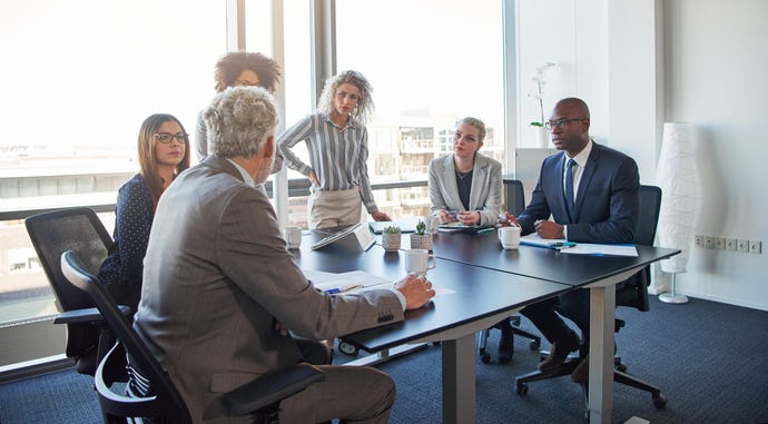 Meeting room with people talking