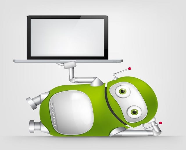 green robot lying on its side holding up a computer