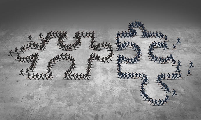 People forming the shapes of interlocking puzzle pieces