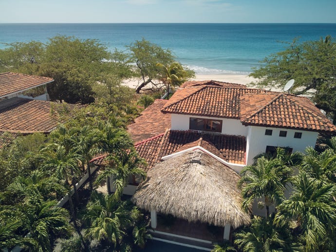 Summer vacation theme. House next to beach line