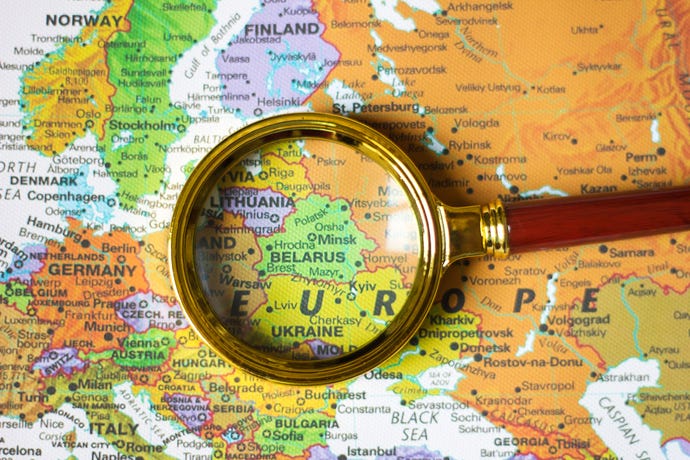 Belarus on European map viewed through a magnifying glass