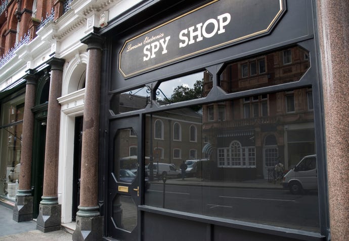 photo of a brick and mortar store with "Spy Shop" sign