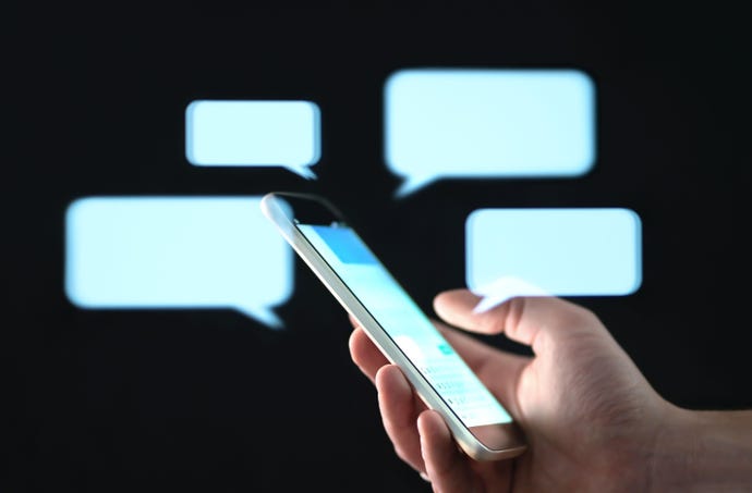 abstract image of mobile phone and floating text message boxes to illustrate a messaging application
