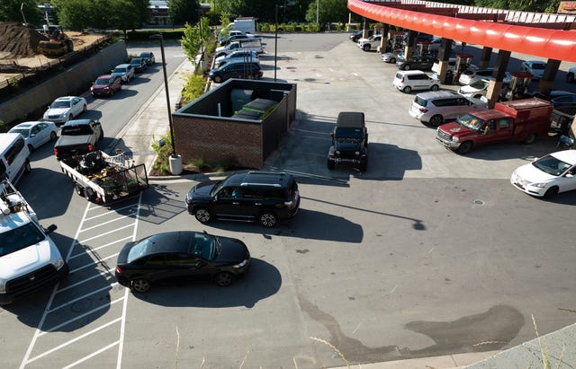 line of cars at gas station