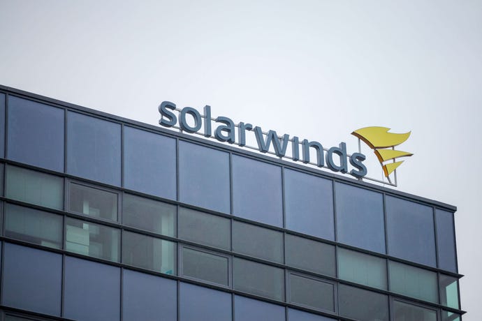 Photo of SolarWinds logo sign on top of window-faced office building in Brno, Czech Republic