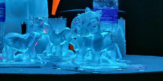 Photo of the Pwnie Awards statuettes, ice sculptures molded from My Little Pony figures, grouped on a table