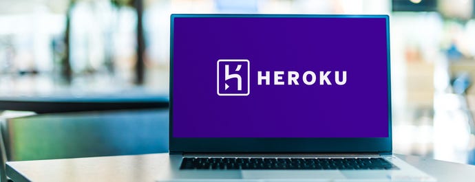 Laptop computer displaying logo of Heroku